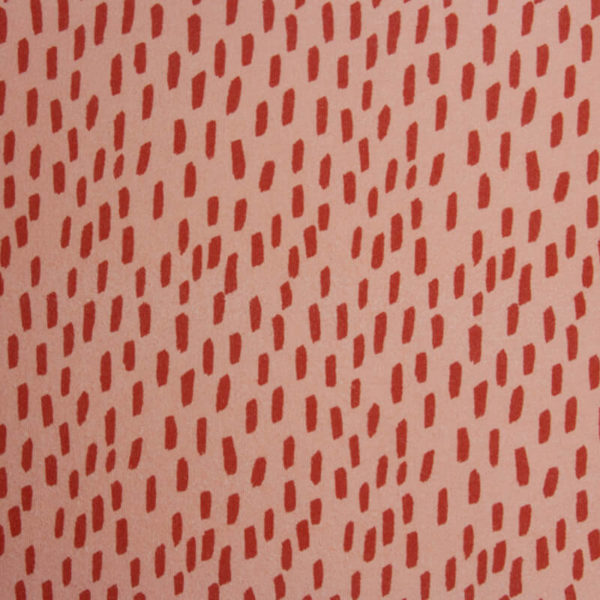 Fondo rosa coral con manchas color teja